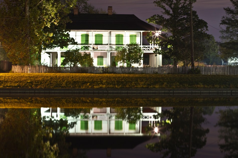 A reflection of a New Orleans home in Bayou St. John Louisiana