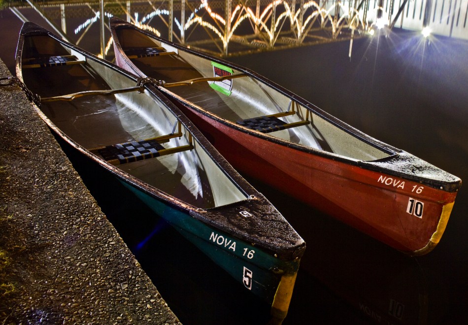 two canoes docked in bayou st. john at night in New Orleans, Louisiana