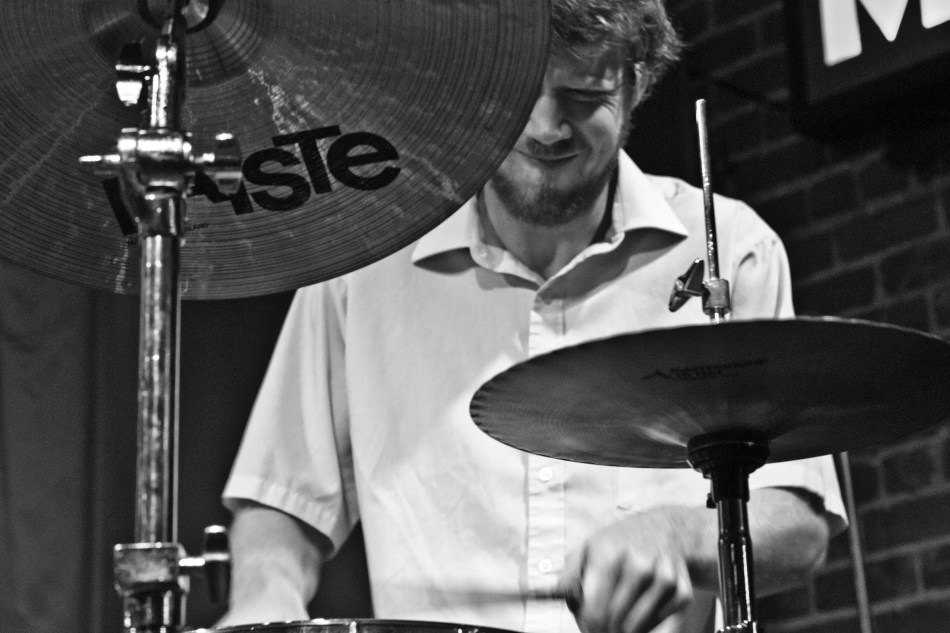 Drummer Joel plays drums with New Orleans jazz trio Chicken & Waffles at Maison on Frenchmen Street in New Orleans, Louisiana