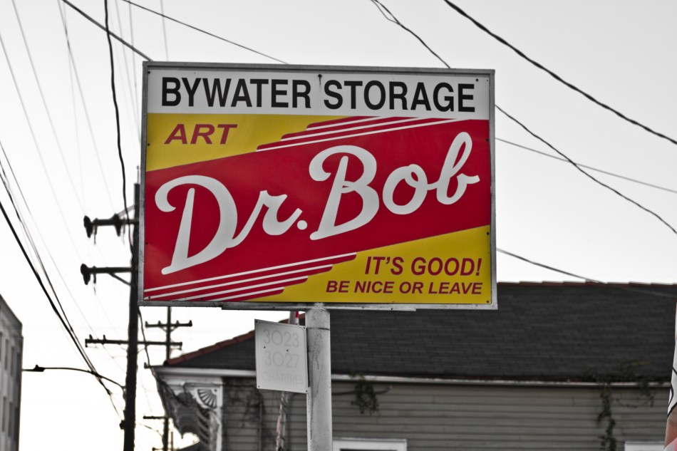 A sign in the Bywater that reads Bywater Storage Art It's Good Dr. Bob Ne Nice Or Leave