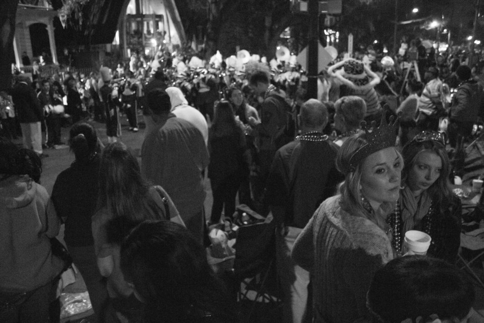 A crowd of people at a Mardi Gras parade in New Orleans, LA in 2013.