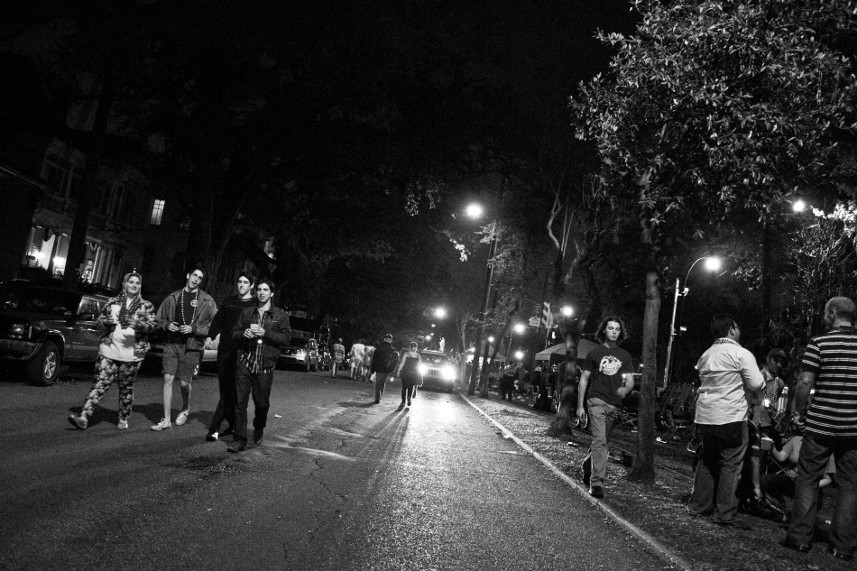 Revelers walk down St. Charles Avenue during Mardi Gras on February 8, 2013 in New Orleans, LA