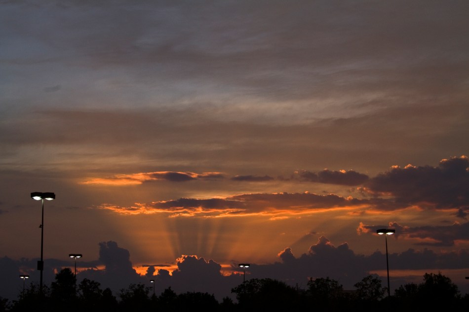 A sunset over a movie theatre parking lot in Elmwood, Louisiana 