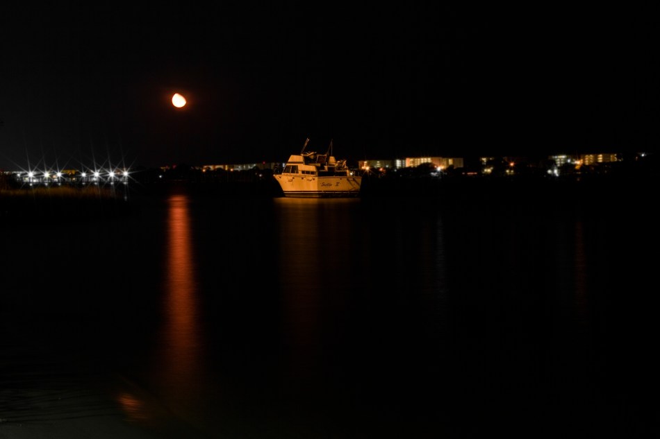 A night shot of a boat anchored in the Gulf of Mexico at Navarre Beach, FL