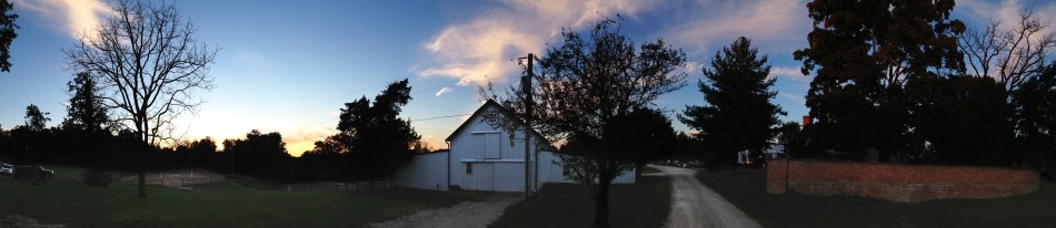 A panoramic view of a farmhouse and surrounding land in rural Missouri