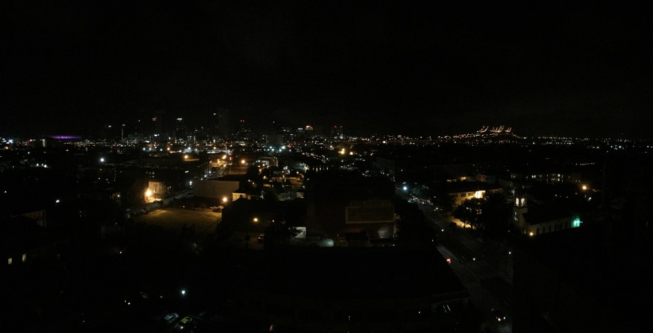 A nighttime panorama of the New orleans skyline taken from on top of the Pontchartrain hotel including the Mercedes Benz Superdome and The Crescent City Connection